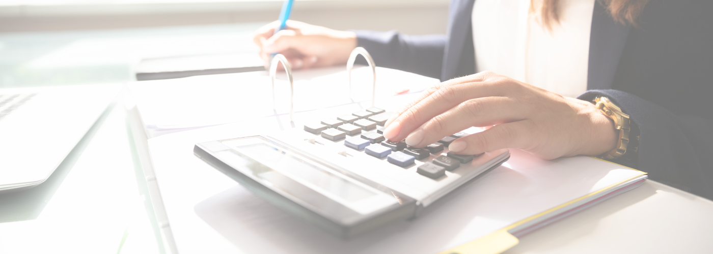 Close up of woman using calculator