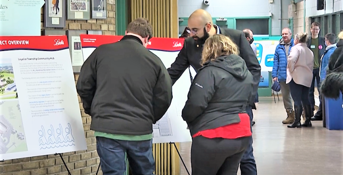 people looking at project boards
