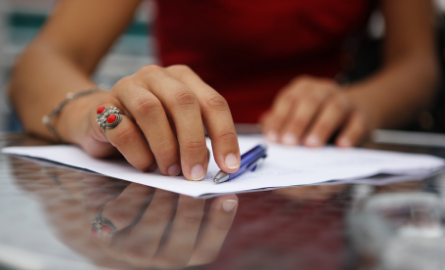 Woman signing an agreement