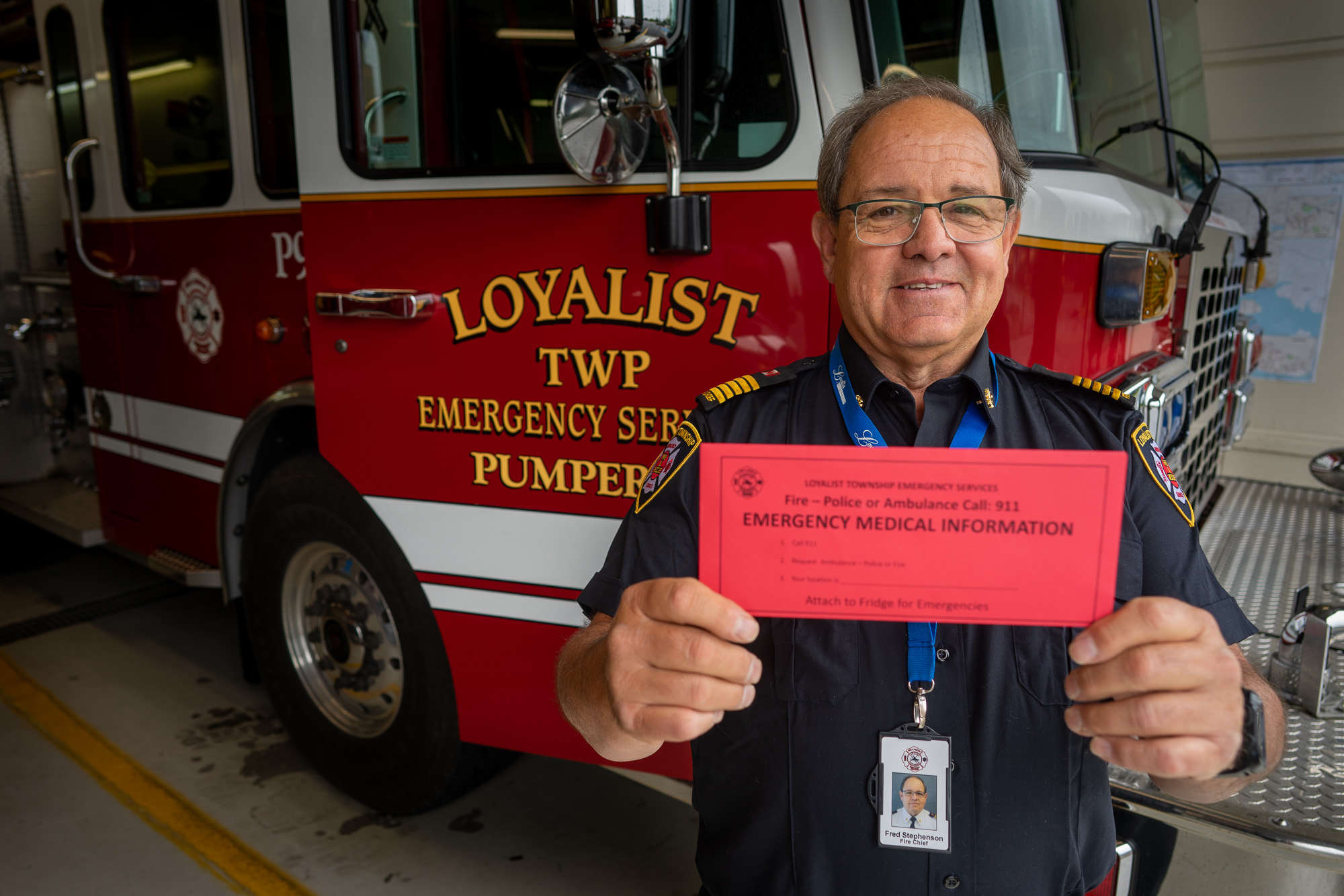 Loyalist Township Director of Emergency Services and Fire Chief Fred Stephenson Holds a Red Envelope