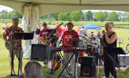 musicians in a band playing outdoors