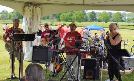 musicians in a band playing outdoors 