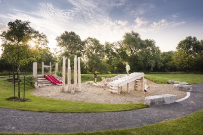 children playing in natural playground