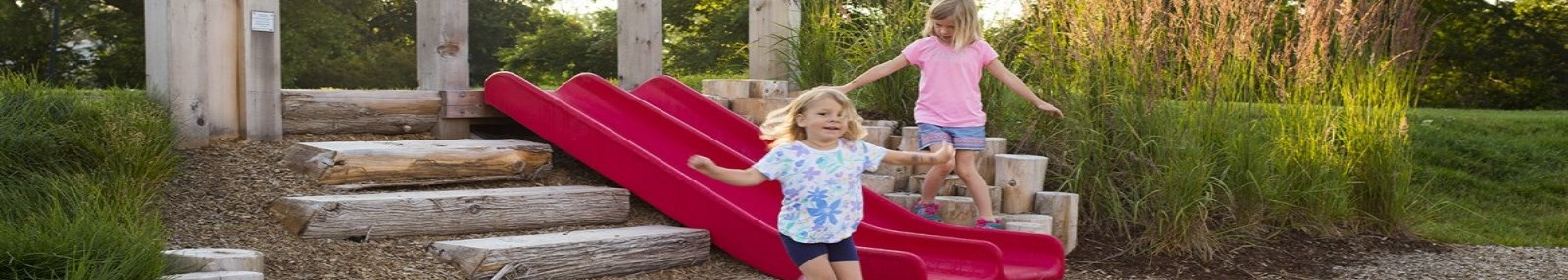 children playing in natural playground