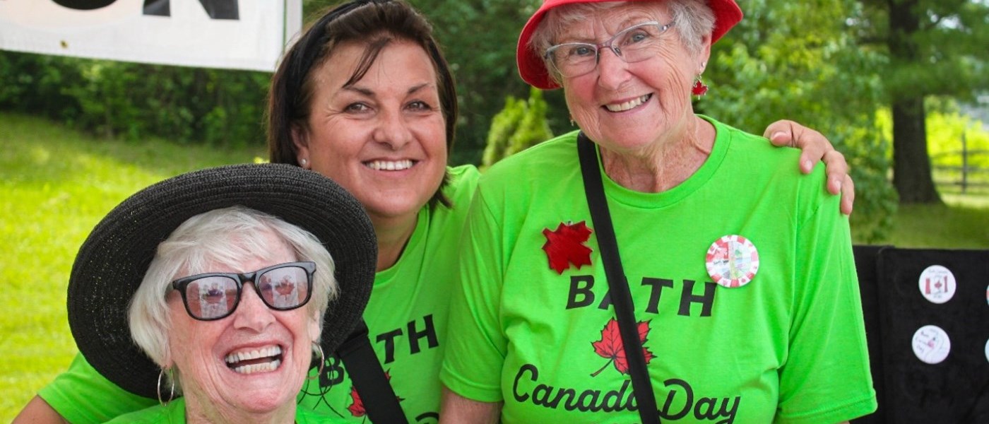 volunteer ladies wearing green bath canada day t-shirts