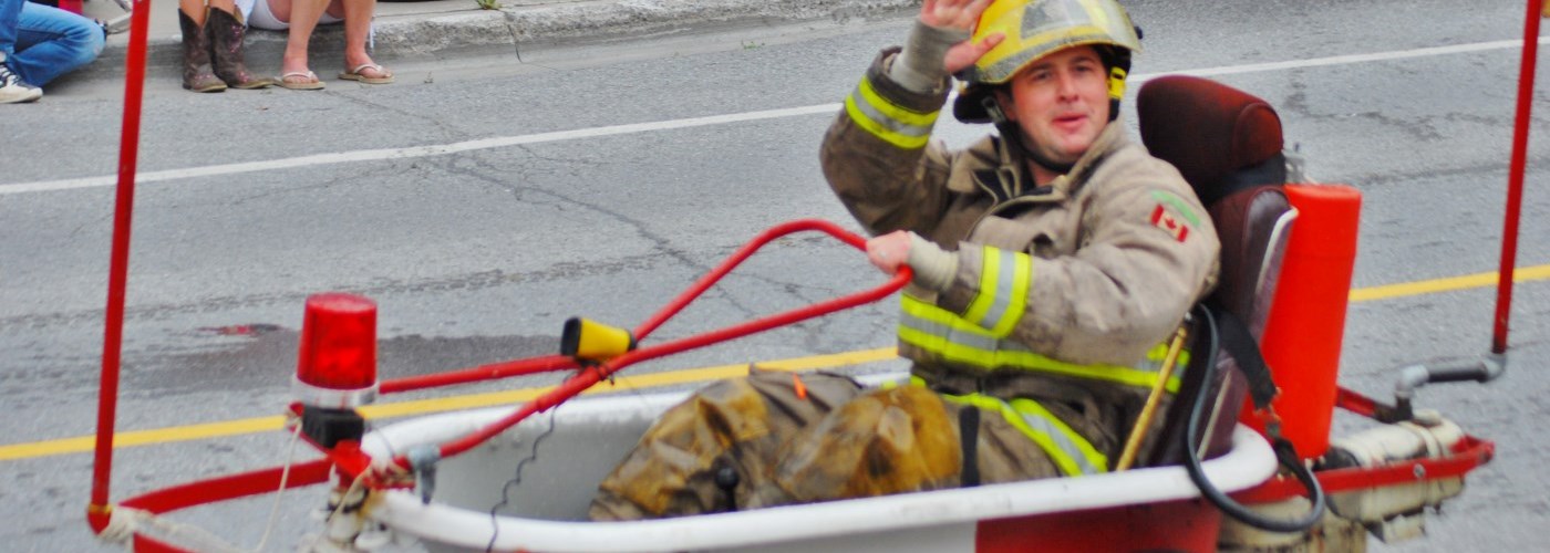 firefighter in bath tub in parade