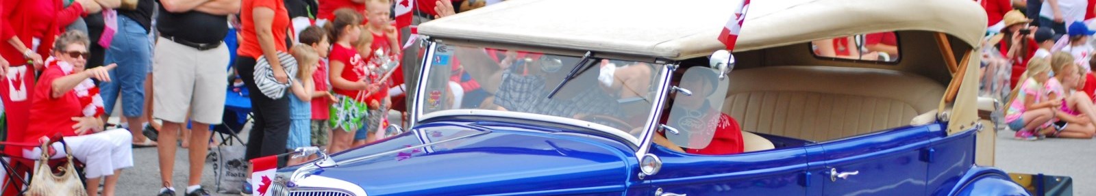blue vintage car at parade