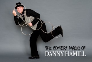 man in suit juggling magic rings