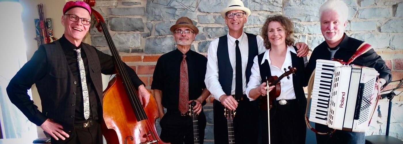 five people in a band with musical instruments