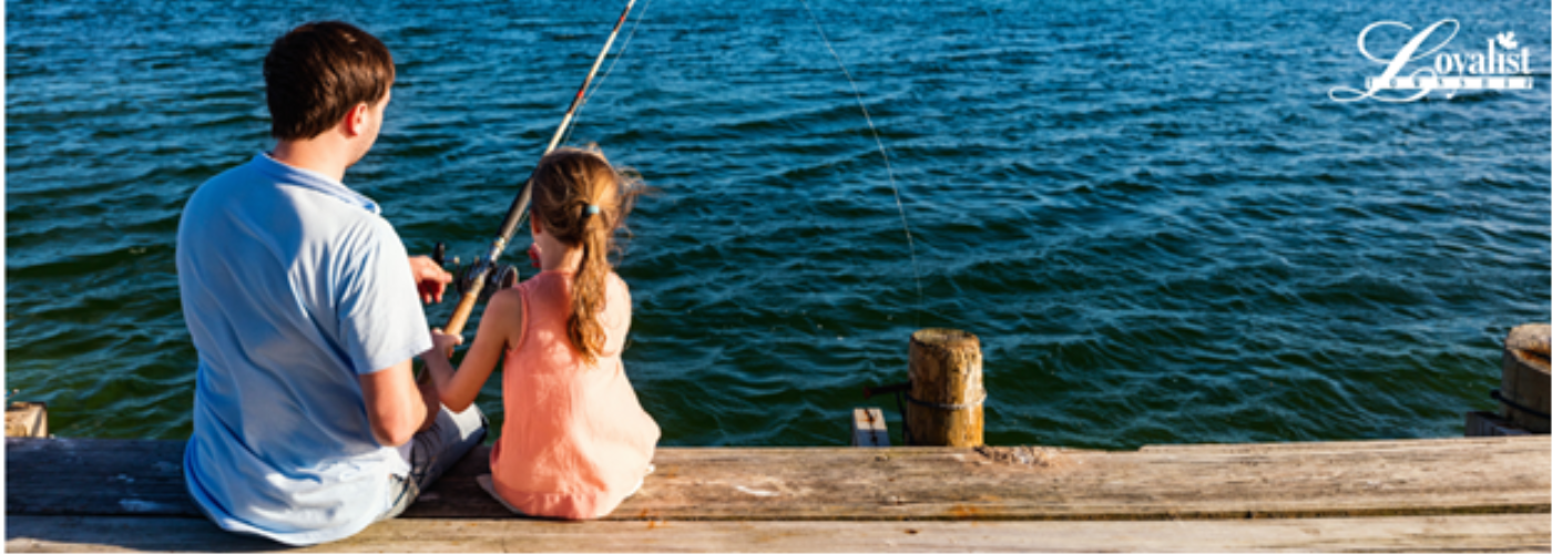 father and daughter fishing on dock