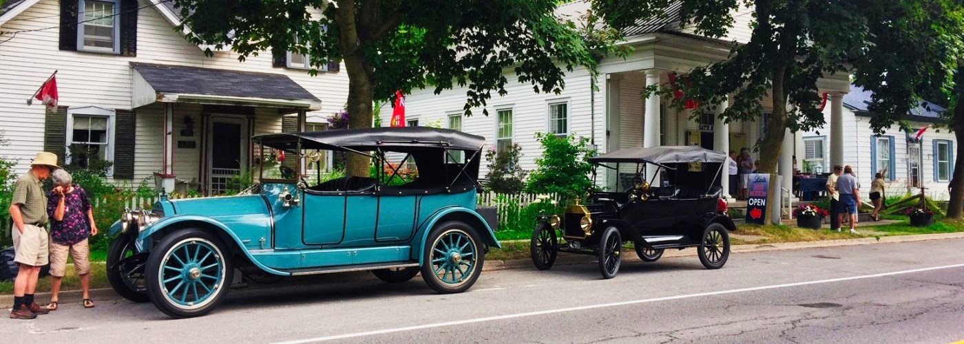 turquoise vintage car parked on street