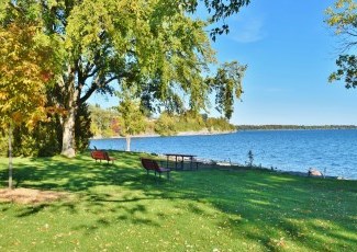 seats overlooking lake on sunny day