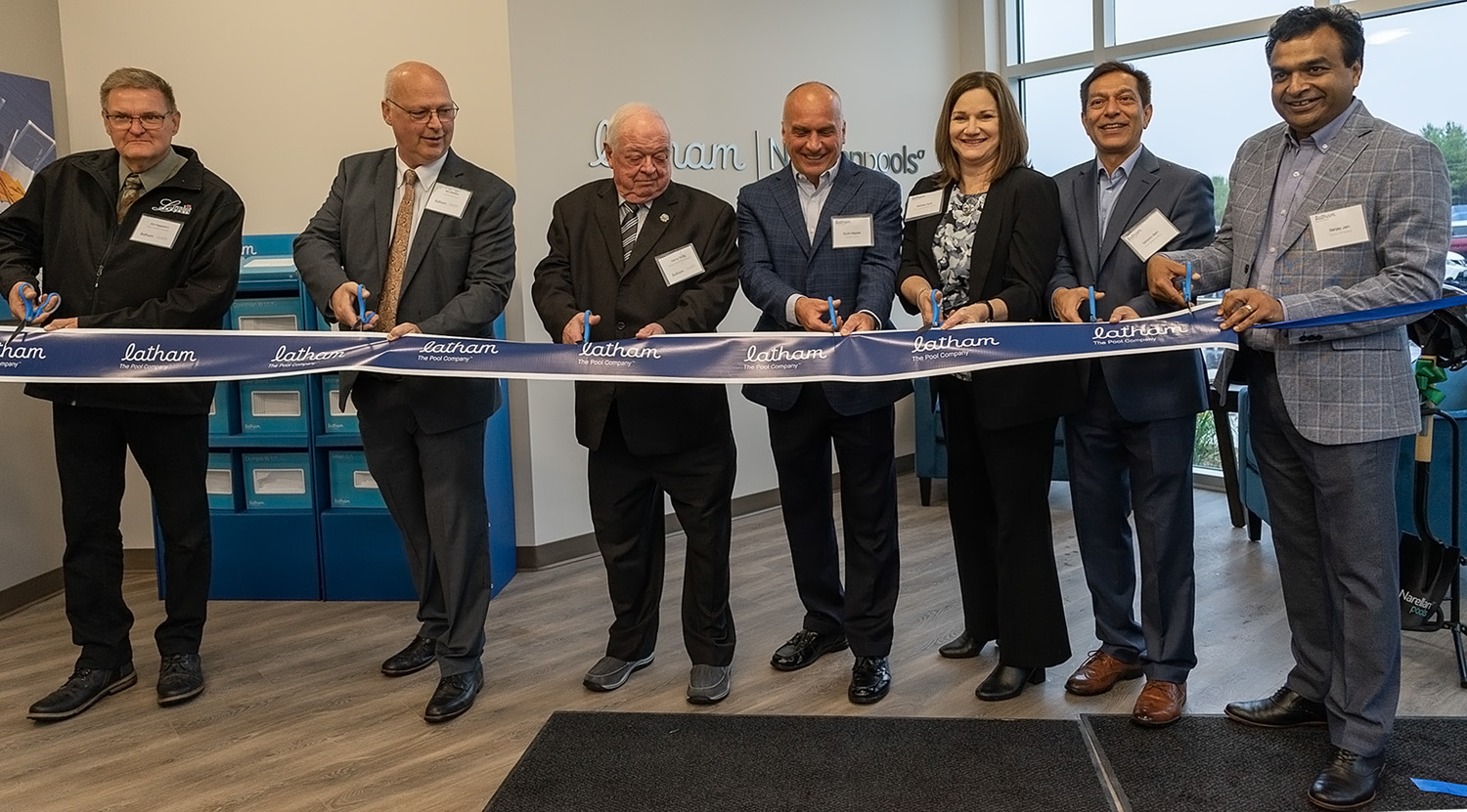 Image of Local officials and Latham Executives cutting the ribbon.