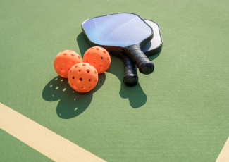 pickleball bats on green background