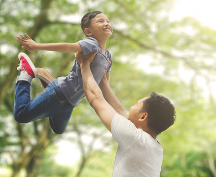 Father holding son up in the air