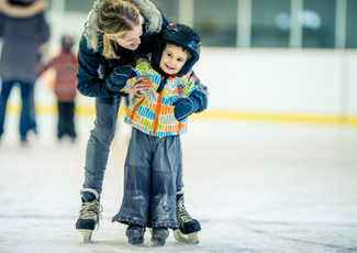 Mother and child ice skating