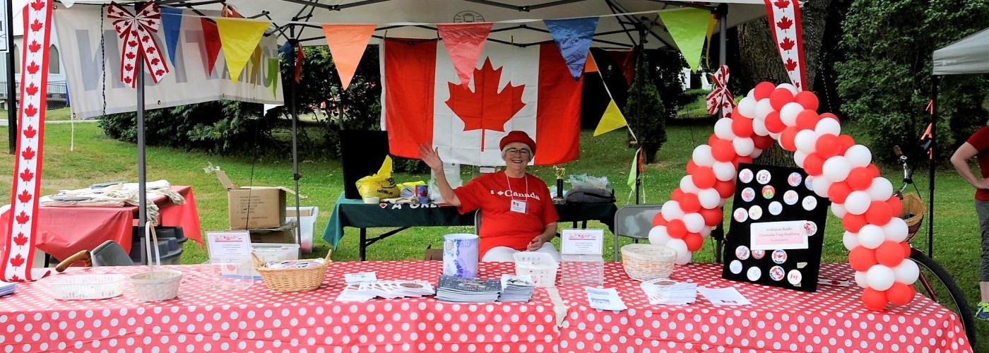 welcome booth for bath cnaada day with bunting and giveaways