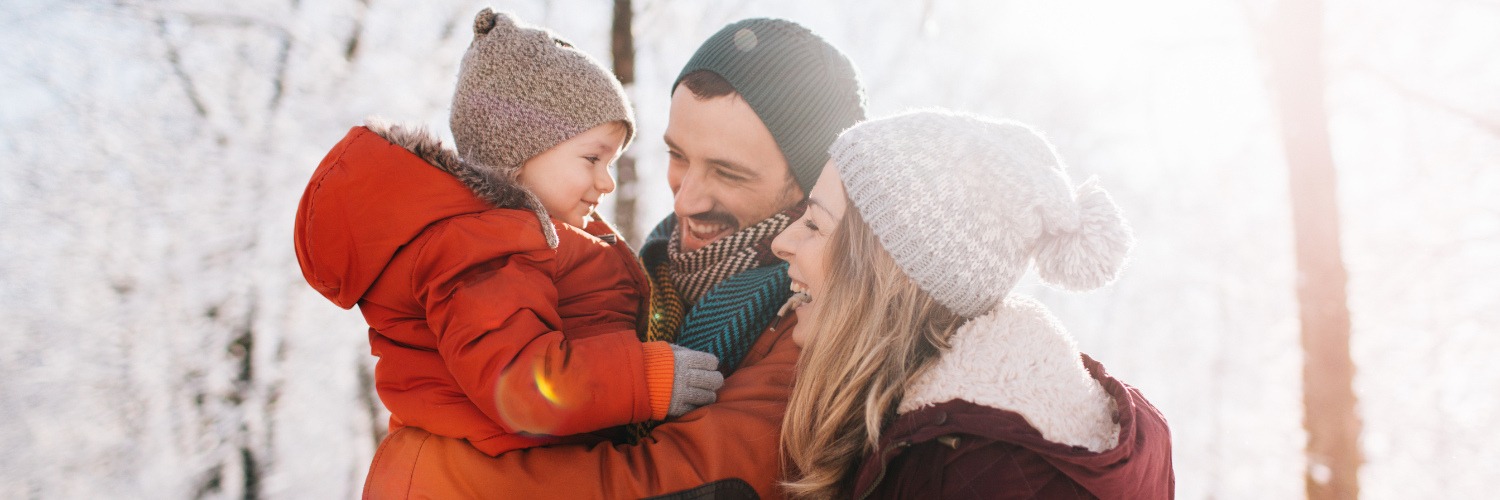Family playing in the snow