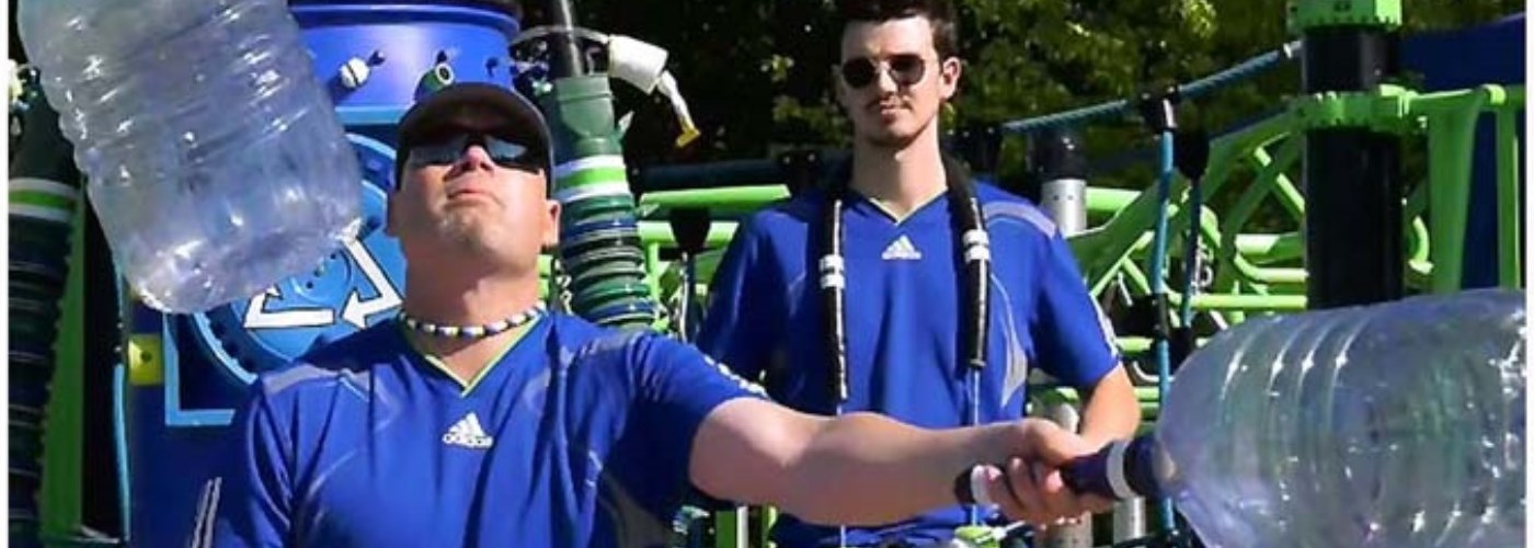 man juggling water bottles