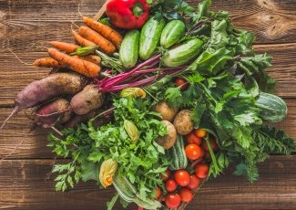 Raw vegetables on wooden table