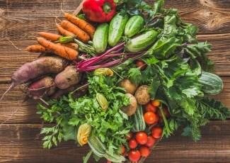 Raw vegetables on wooden table