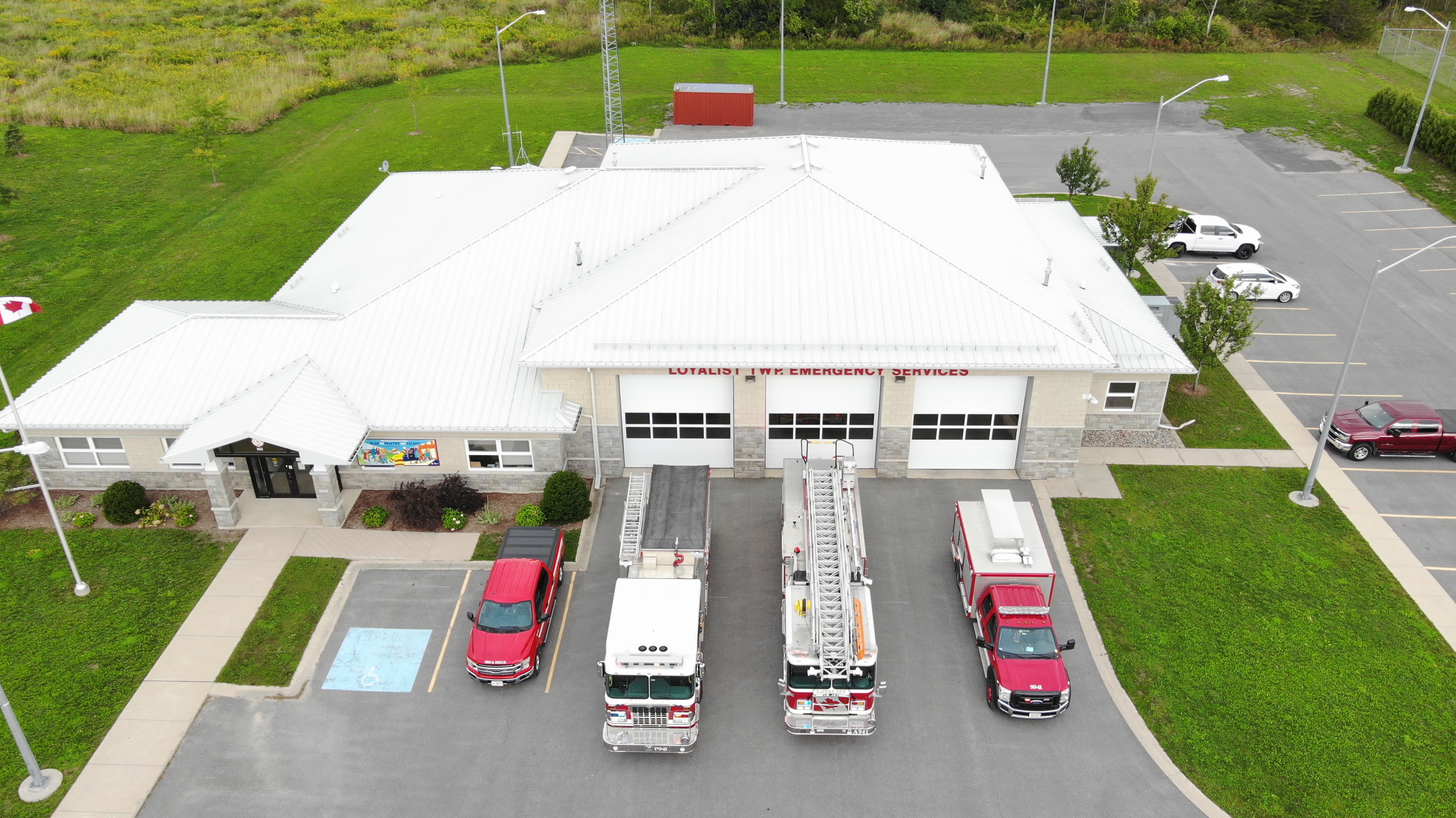 Amherstview fire station wtih trucks parked in front