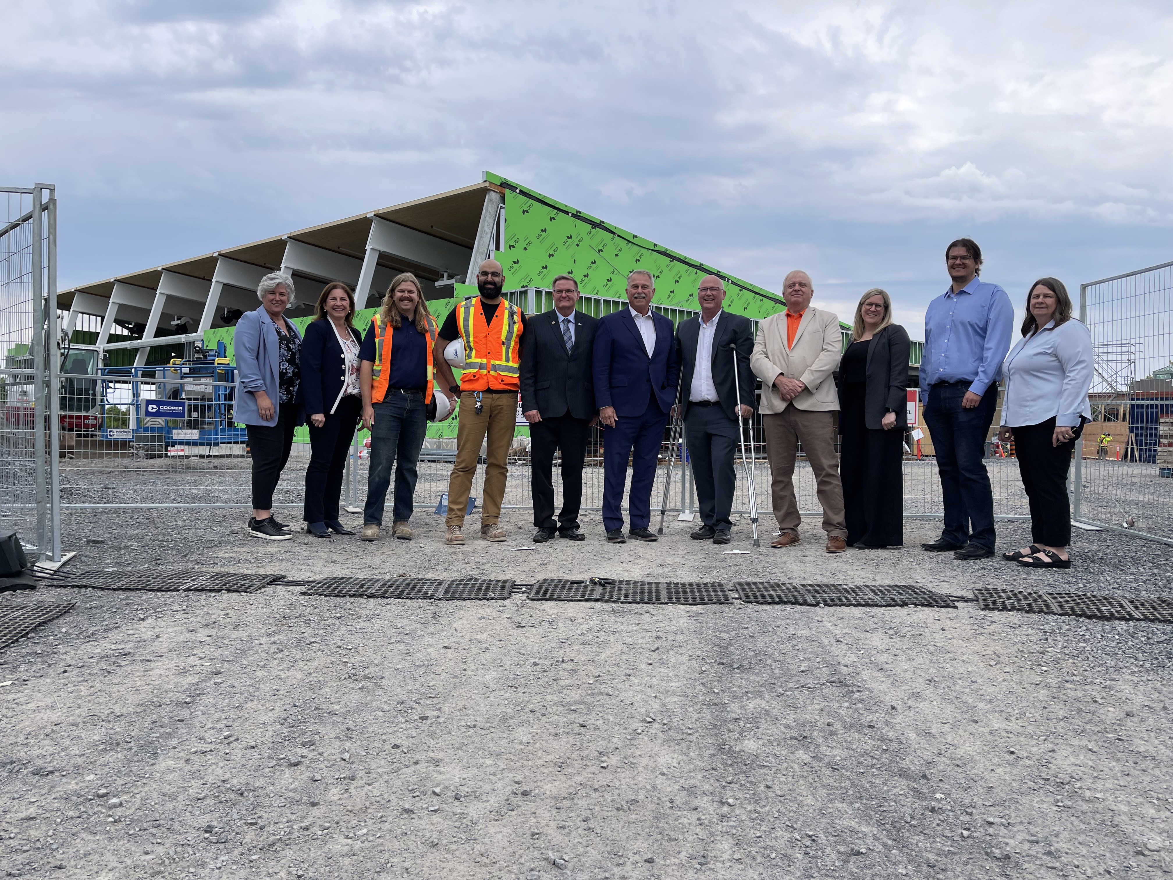 Group of people standing in front of construction site