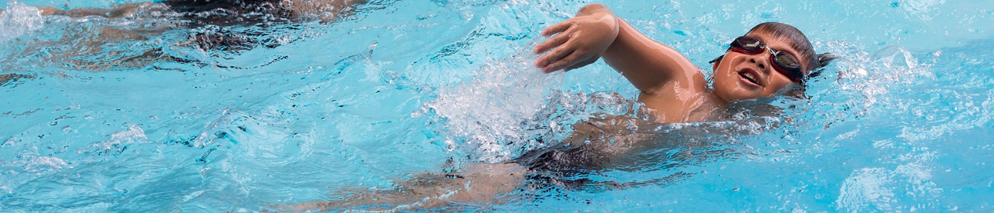 Boy swimming in pool