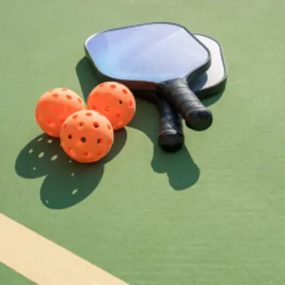 pickleball bats on green background