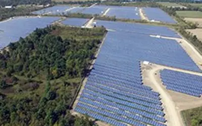 Lanscape of a field with solar panels.