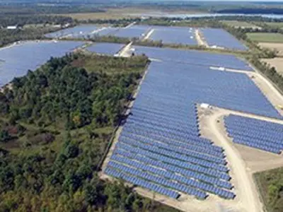 Lanscape of a field with solar panels.