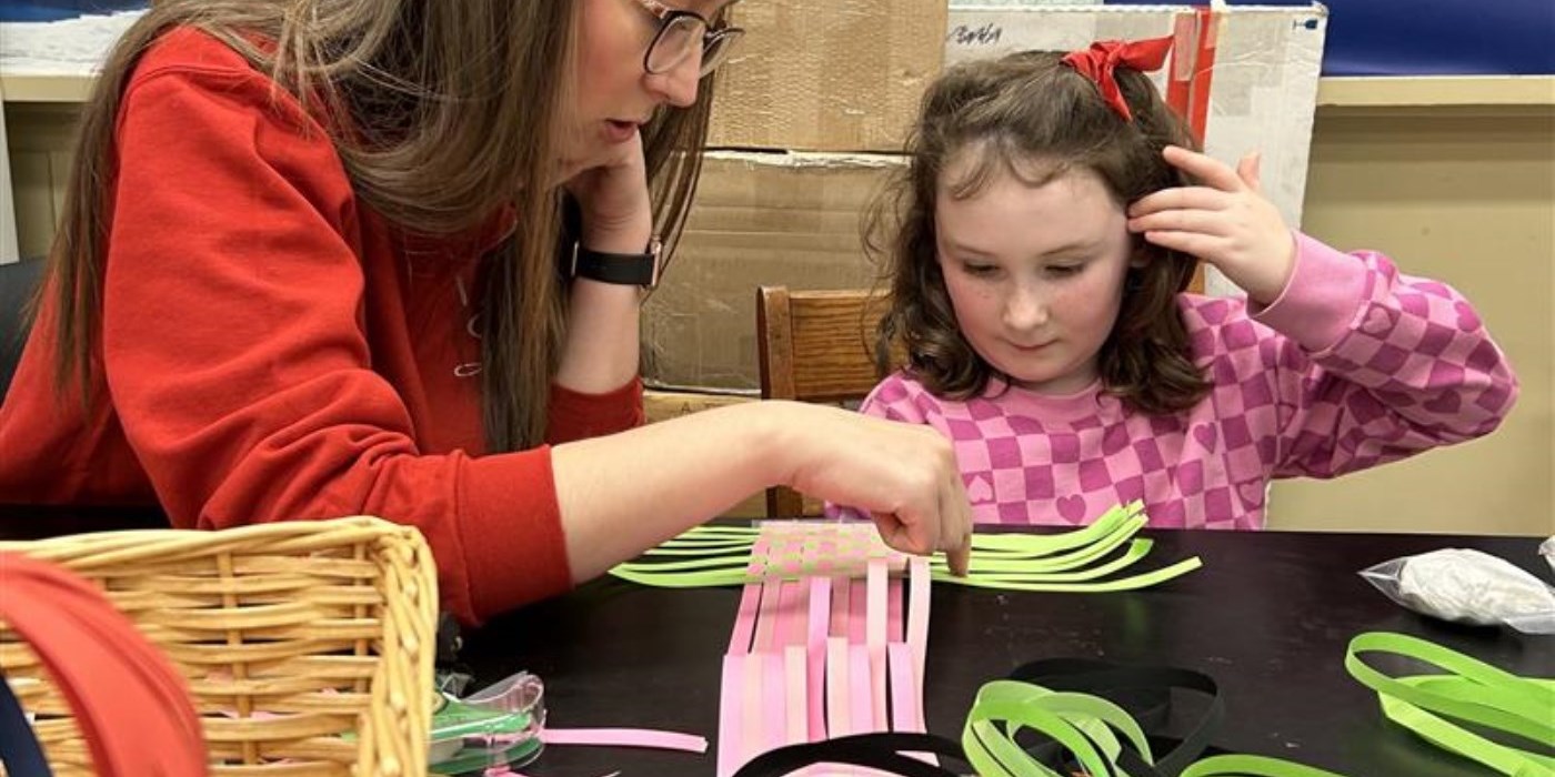 adult and child doing paper crafts
