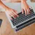 Person typing on laptop