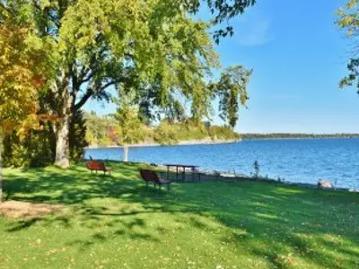 seats overlooking lake on sunny day
