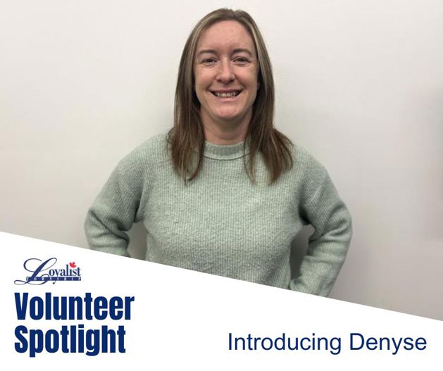 Woman in grey sweatshirt smiling