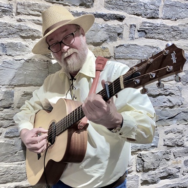 man with guitar and hat