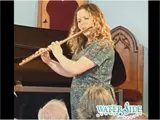 Woman playing the flute.